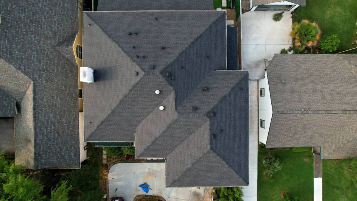 Second top-down drone view of a finished roof replacement in Bellaire, TX