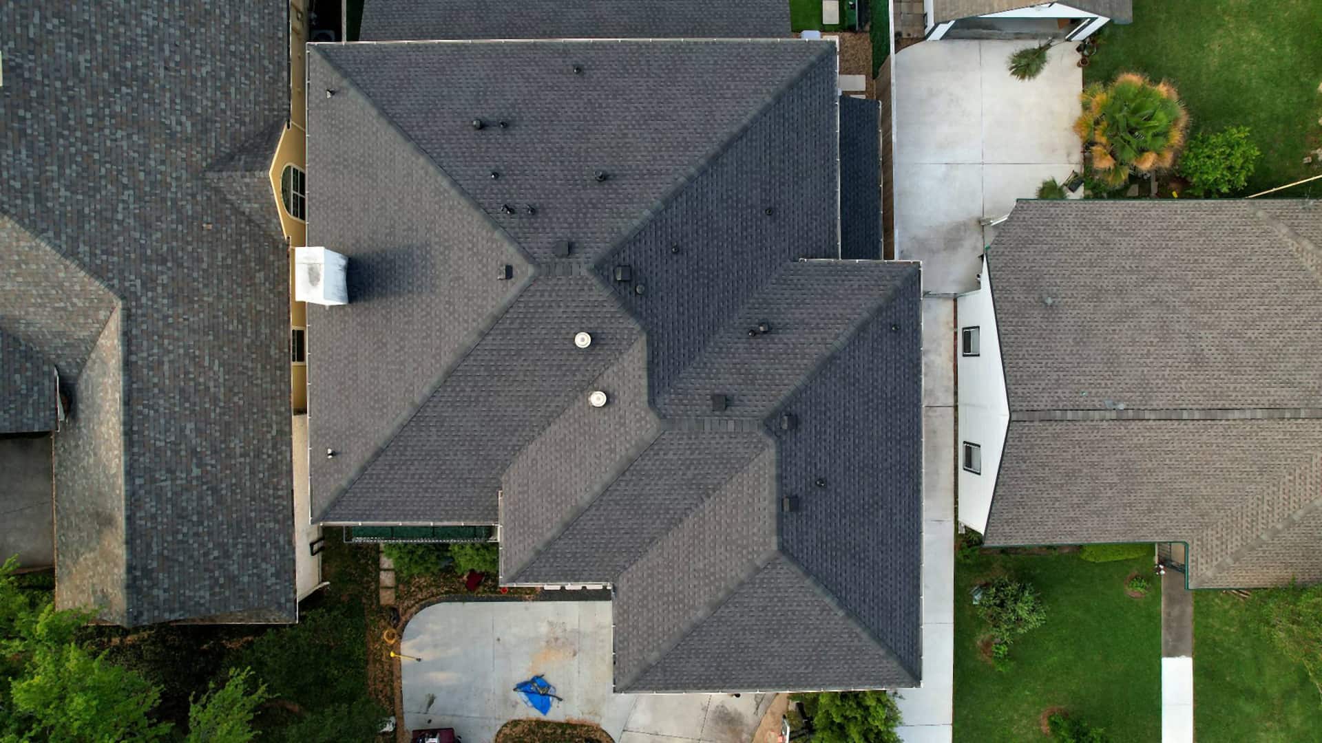 Second top-down drone view of a finished roof replacement in Bellaire, TX
