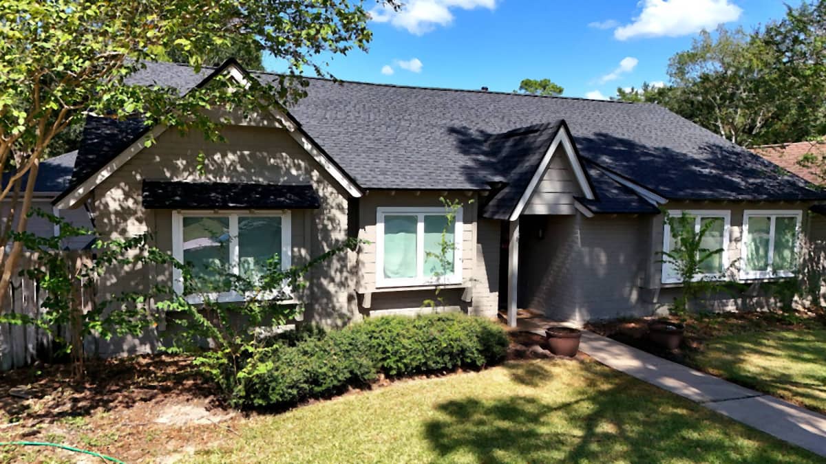 Street-level front view of a Cypress, TX home with a completed dark charcoal shingle roof
