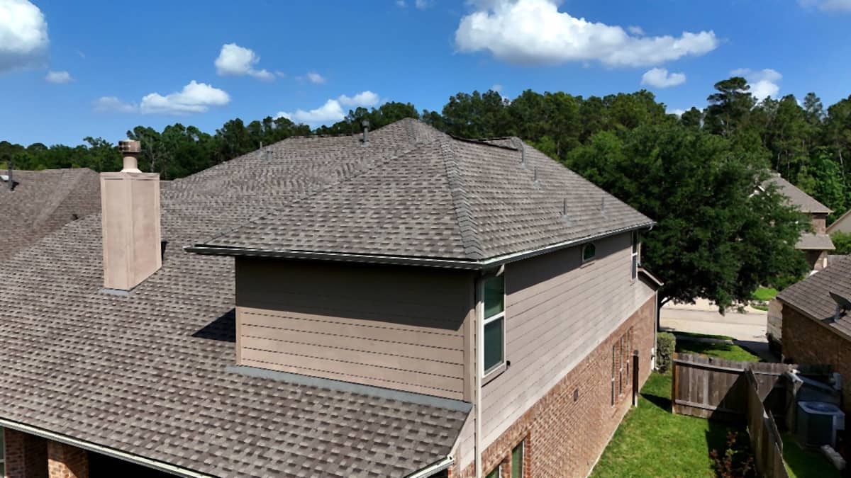 Aerial view of a completed shingle roof replacement on a Tomball, TX home