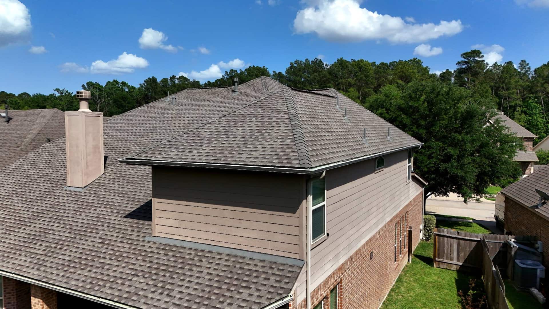 Aerial view of a completed shingle roof replacement on a Tomball, TX home